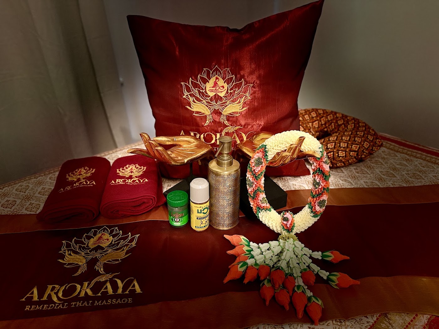 Arokaya’s burgundy linens and Thai floral garland